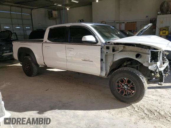 2021 Toyota Tacoma 4WD SR5 with VIN 3TMDZ5BN4MM103311, listed as a Copart auction lot 46486445 with 125,685 mi miles and Salvage Title. Bid and sale history available at carsss.com. Image 4.