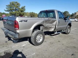 2002 Ford F-250 XL with VIN 1FTNF21L02EA83007, listed as a Copart auction lot 87880345 with 104,889 mi miles and Salvage title. Bid and sale history available at DreamBid. Image 3.