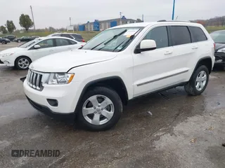 2012 Jeep Grand Cherokee Laredo with VIN 1C4RJFAG6CC297958, listed as a IAAI auction lot 40859811 with 213,499 mi miles. Bid and sale history available at carsss.com. Image 2.
