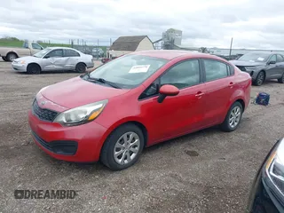 2012 Kia Rio LX with VIN KNADM4A30C6094000, listed as a IAAI auction lot 42059778 with 127,957 mi miles. Bid and sale history available at carsss.com. Image 2.