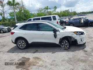 2020 Ford Escape Titanium Hybrid with VIN 1FMCU0DZ3LUC07842, listed as a IAAI auction lot 42456359 with 62,756 mi miles and . Bid and sale history available at DreamBid. Image 14.
