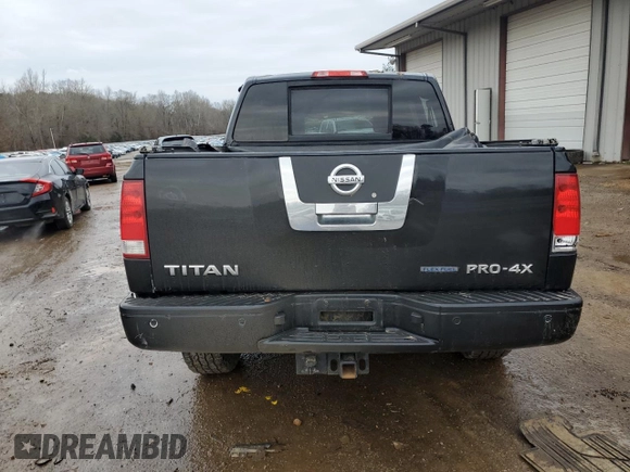2011 Nissan Titan Pro-4X z VIN 1N6BA0EC2BN325891, wystawiony jako Copart lot #43241505 z przebiegiem Nie podano mil oraz Szkoda całkowita • Salvage title. Historia ofert i sprzedaży dostępna na DreamBid. Obrazek 6.