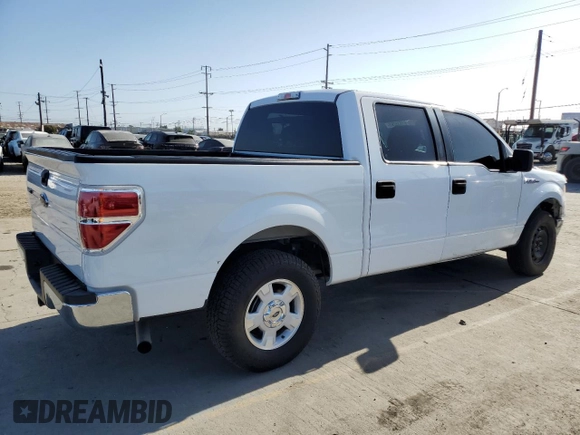2014 Ford F-150 XL with VIN 1FTFW1CT1EKE22892, listed as a Copart auction lot 61635265 with 14,203 mi miles and Salvage title. Bid and sale history available at DreamBid. Image 3.