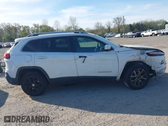 2015 Jeep Cherokee Latitude with VIN 1C4PJLCS6FW689607, listed as a IAAI auction lot 42103286 with 142,479 mi miles. Bid and sale history available at carsss.com. Image 13.