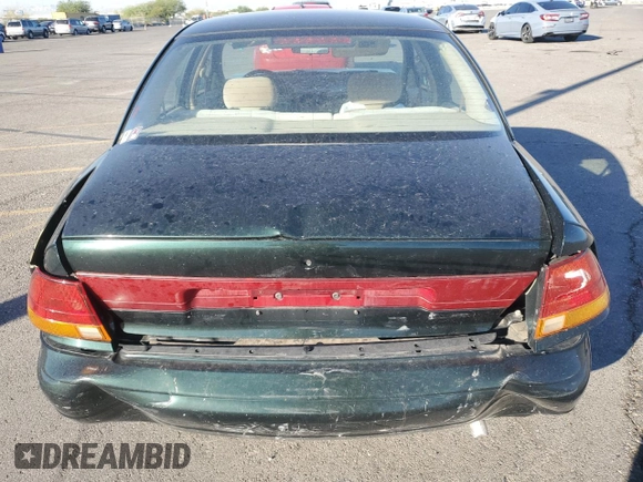 1996 Saturn SL with VIN 1G8ZK5272TZ137198, listed as a Copart auction lot 72446614 with 99,586 mi miles and Salvage title. Bid and sale history available at DreamBid. Image 6.