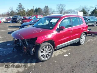 2012 Volkswagen Tiguan S with VIN WVGBV7AX2CW078629, listed as a IAAI auction lot 41332445 with 94,239 mi miles and . Bid and sale history available at DreamBid. Image 2.