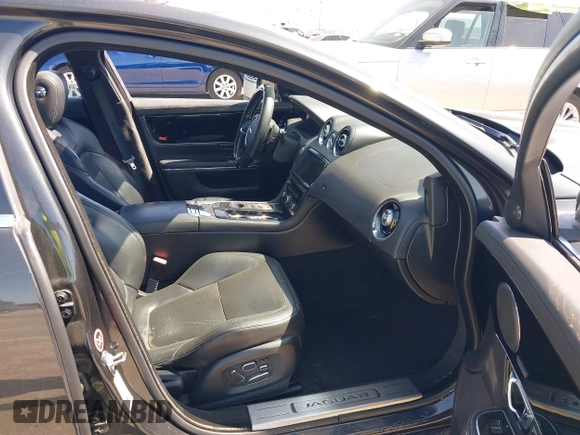 2015 Jaguar XJ R-Sport with VIN SAJWJ1CD6F8V83990, listed as a IAAI auction lot 41936162 with Not Provided miles and . Bid and sale history available at DreamBid. Image 5.