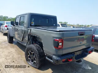 2021 Jeep Gladiator Rubicon with VIN 1C6JJTBG2ML515932, listed as a IAAI auction lot 42471704 with 57,775 mi miles and . Bid and sale history available at DreamBid. Image 3.