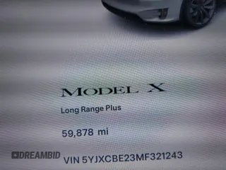 2021 Tesla Model X Long Range Plus with VIN 5YJXCBE23MF321243, listed as a IAAI auction lot 42100580 with 59,878 mi miles and . Bid and sale history available at carsss.com. Image 15.