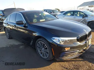 2019 BMW 5 Series 530e iPerformance with VIN WBAJA9C59KB398763, listed as a IAAI auction lot 41300954 with 124,568 mi miles. Bid and sale history available at carsss.com. Image 1.