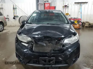 2015 Honda Fit EX-L z VIN 3HGGK5H88FM721318, wystawiony jako Copart lot #56717255 z przebiegiem 107 235 mil mil oraz Szkoda całkowita • Salvage title. Historia ofert i sprzedaży dostępna na DreamBid. Obrazek 5.