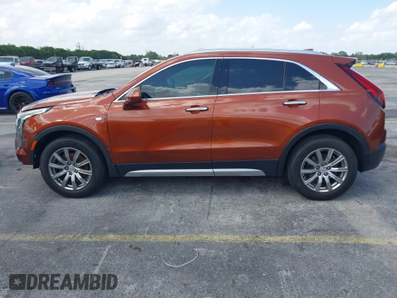 2019 Cadillac XT4 FWD Premium Luxury z VIN 1GYFZCR41KF183507, wystawiony jako IAAI lot #41987176 z przebiegiem 64 803 mil mil oraz . Historia ofert i sprzedaży dostępna na DreamBid. Obrazek 14.