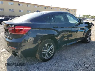 2015 BMW X6 xDrive50i with VIN 5UXKU6C50F0F94199, listed as a Copart auction lot 70680312 with 106,650 mi miles. Bid and sale history available at carsss.com. Image 3.