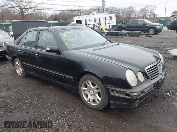 2002 Mercedes-Benz E-Class with VIN WDBJF82J52X064244, listed as a IAAI auction lot 41819863 with 999,999 mi miles. Bid and sale history available at carsss.com. Image 1.