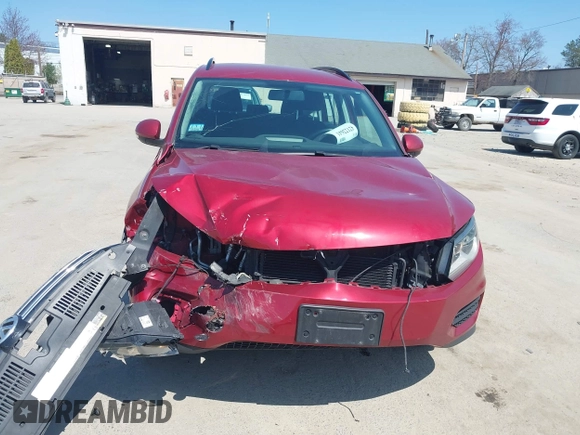2015 Volkswagen Tiguan SE z VIN WVGBV7AX7FW056002, wystawiony jako IAAI lot #42122641 z przebiegiem 77 037 mil mil oraz . Historia ofert i sprzedaży dostępna na DreamBid. Obrazek 6.