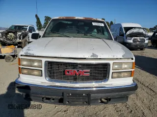 1998 GMC Suburban z VIN 1GKFK16R1WJ700312, wystawiony jako Copart lot #73160574 z przebiegiem 150 174 mil mil oraz Czysty tytuł • Clean title. Historia ofert i sprzedaży dostępna na DreamBid. Obrazek 5.