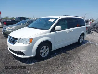 2012 Dodge Grand Caravan SXT with VIN 2C4RDGCG9CR200432, listed as a IAAI auction lot 42027477 with 99,076 mi miles and . Bid and sale history available at DreamBid. Image 2.