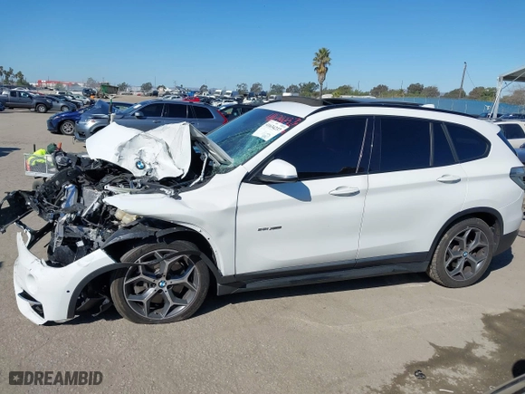 2016 BMW X1 xDrive28i with VIN WBXHT3C32G5E51855, listed as a IAAI auction lot 41634237 with 69,101 mi miles. Bid and sale history available at carsss.com. Image 13.