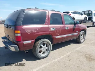 2001 GMC Yukon SLT with VIN 1GKEK13V81J100005, listed as a IAAI auction lot 42090494 with 276,042 mi miles. Bid and sale history available at carsss.com. Image 4.