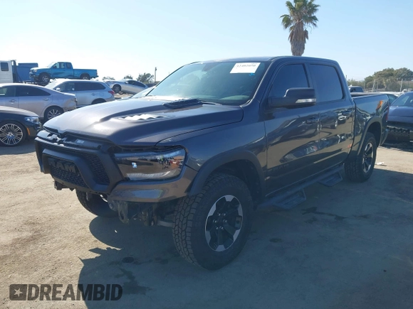 2022 Ram 1500 Rebel z VIN 1C6SRFLT4NN177112, wystawiony jako IAAI lot #42402050 z przebiegiem 26 239 mil mil oraz . Historia ofert i sprzedaży dostępna na DreamBid. Obrazek 17.