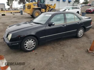 2000 Mercedes-Benz E-Class with VIN WDBJF65J5YB068297, listed as a Copart auction lot 69199004 with 236,751 mi miles and Salvage Title. Bid and sale history available at carsss.com. Image 1.
