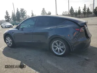2024 Tesla Model Y Long Range with VIN 7SAYGDEE2RA244242, listed as a Copart auction lot 52635095 with 4,994 mi miles and Salvage title. Bid and sale history available at DreamBid. Image 2.