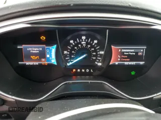 2016 Ford Fusion SE Hybrid z VIN 3FA6P0LUXGR350997, wystawiony jako Copart lot #62301825 z przebiegiem 267 537 mil mil oraz Szkoda całkowita • Salvage title. Historia ofert i sprzedaży dostępna na DreamBid. Obrazek 9.