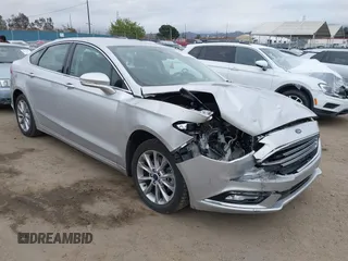 2017 Ford Fusion Energi SE with VIN 3FA6P0PU9HR354096, listed as a IAAI auction lot 42064703 with 69,601 mi miles. Bid and sale history available at carsss.com. Image 1.