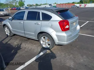 2011 Dodge Caliber Mainstreet with VIN 1B3CB3HA2BD117839, listed as a IAAI auction lot 42101103 with 142,099 mi miles. Bid and sale history available at carsss.com. Image 3.