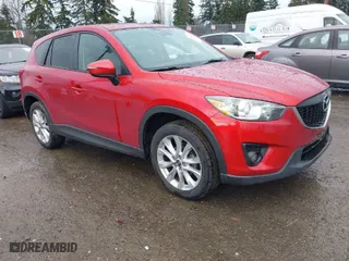 2015 Mazda CX-5 Grand Touring with VIN JM3KE4DY0F0479392, listed as a IAAI auction lot 41659415 with NaN miles. Bid and sale history available at carsss.com. Image 1.