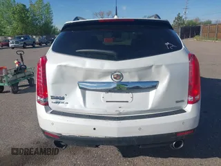 2012 Cadillac SRX Performance Collection z VIN 3GYFNEE30CS652829, wystawiony jako IAAI lot #42156961 z przebiegiem 106 473 mil mil oraz . Historia ofert i sprzedaży dostępna na DreamBid. Obrazek 6.