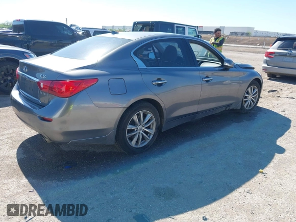 2015 Infiniti Q50 Premium z VIN JN1BV7AR9FM408386, wystawiony jako IAAI lot #42084887 z przebiegiem 122 527 mil mil oraz . Historia ofert i sprzedaży dostępna na DreamBid. Obrazek 4.