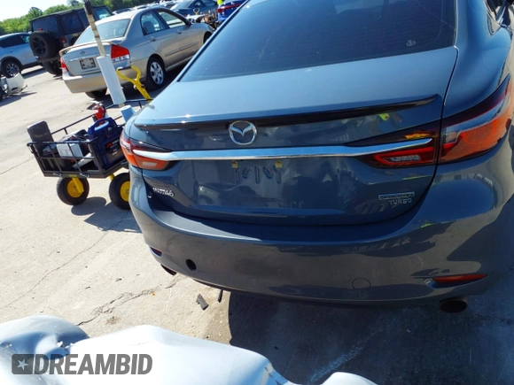 2021 Mazda 6 Carbon Edition with VIN JM1GL1WY4M1619533, listed as a IAAI auction lot 41979213 with 84,783 mi miles and . Bid and sale history available at DreamBid. Image 16.