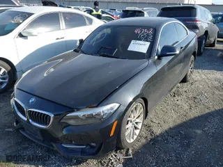2016 BMW 2 Series 228i with VIN WBA1F9C5XGV544661, listed as a IAAI auction lot 41516695 with 84,243 mi miles. Bid and sale history available at carsss.com. Image 2.