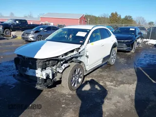 2022 Mazda CX-30 S Select z VIN 3MVDMBBL8NM448787, wystawiony jako IAAI lot #41577914 z przebiegiem 64 552 mil mil oraz . Historia ofert i sprzedaży dostępna na DreamBid. Obrazek 2.