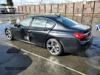 2017 BMW 7 Series 740i with VIN WBA7E2C59HG739788, listed as a Copart auction lot 48073105 with 36,274 mi miles and Salvage Title. Bid and sale history available at carsss.com. Image 2.