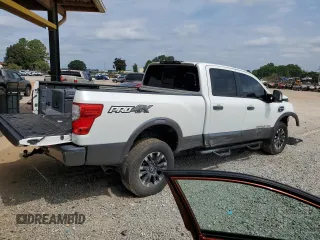 2018 Nissan Titan Platinum Reserve with VIN 1N6BA1F49JN521225, listed as a Copart auction lot 69831004 with 92,536 mi miles and Salvage title. Bid and sale history available at DreamBid. Image 3.