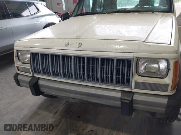 1996 Jeep Cherokee Country z VIN 1J4FT78S0TL280645, wystawiony jako IAAI lot #42340813 z przebiegiem 288 418 mil mil oraz . Historia ofert i sprzedaży dostępna na DreamBid. Obrazek 6.