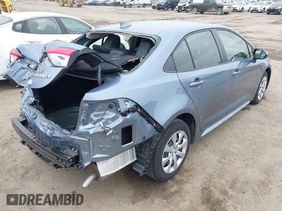 2023 Toyota Corolla Hybrid LE with VIN JTDBCMFE8PJ013271, listed as a IAAI auction lot 42099797 with 14,080 mi miles and . Bid and sale history available at carsss.com. Image 4.