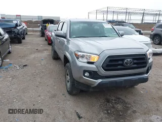 2021 Toyota Tacoma SR z VIN 3TYAX5GN2MT015282, wystawiony jako IAAI lot #42288312 z przebiegiem 104 899 mil mil oraz . Historia ofert i sprzedaży dostępna na DreamBid. Obrazek 1.