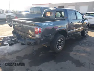 2023 Toyota Tacoma SR with VIN 3TMCZ5AN2PM553928, listed as a IAAI auction lot 40999044 with 9,210 mi miles and . Bid and sale history available at DreamBid. Image 4.