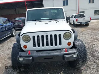 2012 Jeep Wrangler Sport z VIN 1C4AJWAG5CL171961, wystawiony jako IAAI lot #42590232 z przebiegiem 126 372 mil mil oraz . Historia ofert i sprzedaży dostępna na DreamBid. Obrazek 12.
