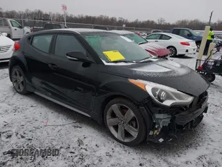 2014 Hyundai Veloster Turbo with VIN KMHTC6AE7EU207871, listed as a IAAI auction lot 41174004 with 130,347 mi miles and . Bid and sale history available at DreamBid. Image 1.