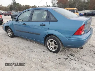 2001 Ford Focus LX with VIN 1FAHP33P01W332260, listed as a Copart auction lot 83221654 with 104,028 mi miles and Salvage Title. Bid and sale history available at DreamBid. Image 2.