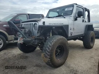 2003 Jeep Wrangler Rubicon z VIN 1J4FA69S53P340085, wystawiony jako Copart lot #74564574 z przebiegiem Nie podano mil oraz Szkoda całkowita • Salvage title. Historia ofert i sprzedaży dostępna na DreamBid. Obrazek 1.
