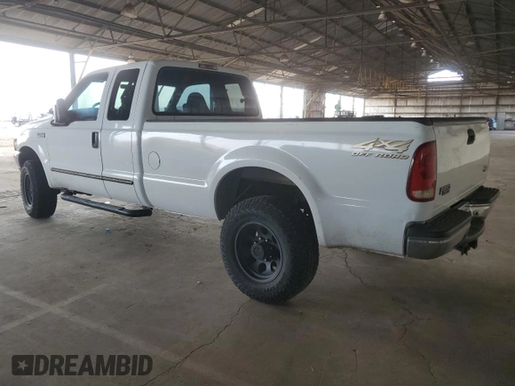 2000 Ford Super Duty F-250 XL with VIN 1FTNX21S9YED03242, listed as a Copart auction lot 74542704 with 218,739 mi miles and Salvage Title. Bid and sale history available at carsss.com. Image 2.