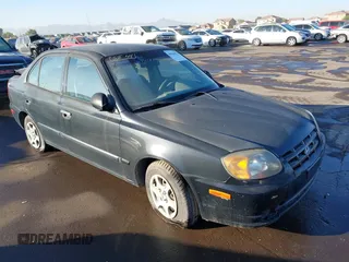 2005 Hyundai Accent GLS with VIN KMHCG45C75U632587, listed as a IAAI auction lot 40946829 with 114,666 mi miles. Bid and sale history available at carsss.com. Image 1.