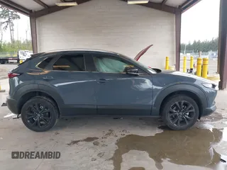 2023 Mazda CX-30 S Carbon Edition with VIN 3MVDMBCM1PM558865, listed as a IAAI auction lot 42298416 with 19,276 mi miles and . Bid and sale history available at DreamBid. Image 14.