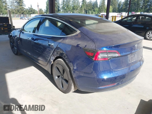 2018 Tesla Model 3 Long Range Battery z VIN 5YJ3E1EA6JF041970, wystawiony jako IAAI lot #42224514 z przebiegiem 79 744 mil mil oraz . Historia ofert i sprzedaży dostępna na DreamBid. Obrazek 3.