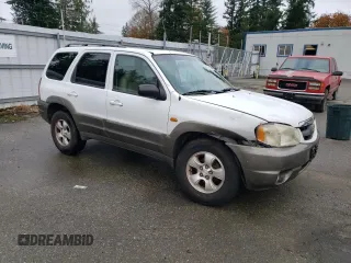2001 Mazda Tribute LX with VIN 4F2CU08101KM11452, listed as a Copart auction lot 76796064 with 175,584 mi miles and Salvage Title. Bid and sale history available at DreamBid. Image 4.